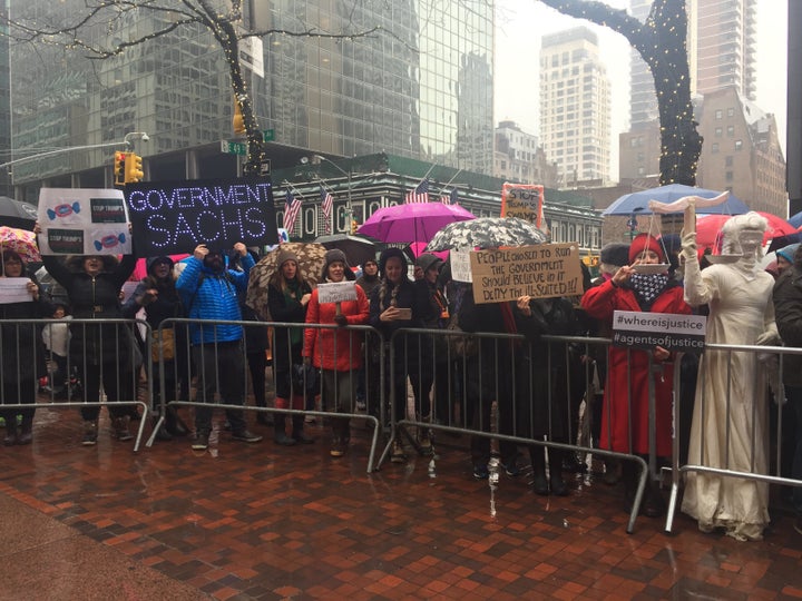 Hundreds of protesters endured the harsh weather conditions to speak out against Trump's proposed cabinet.