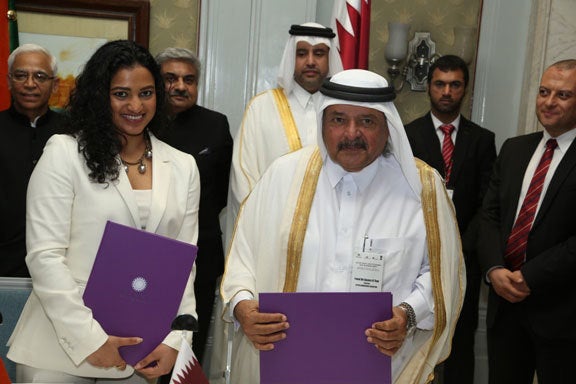 <p>H.E. Sheikh Faisal Bin Qassim Al Thani, Chairman of Al Sawari Holding and Al Faisal Holdings and Amruda Nair signing the agreement to create Aiana Hotels & Resorts L.L.C. in March 2015.</p>