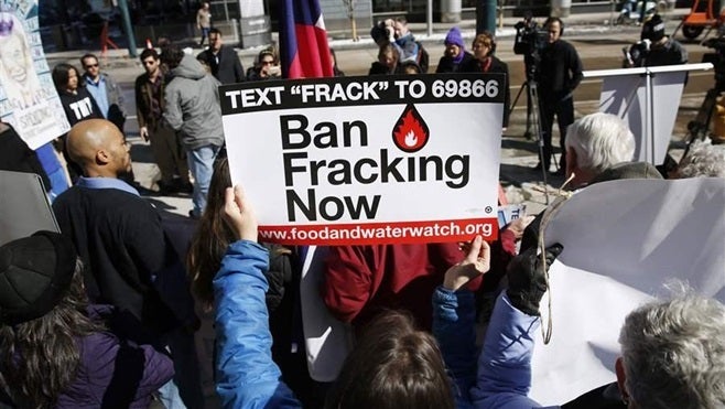 Activists in Denver call for a ban on fracking in 2015. The Colorado Supreme Court ruled that state regulatory power supersedes local bans on fracking. Fracking is one of many policy issues in which states and cities clash over control.