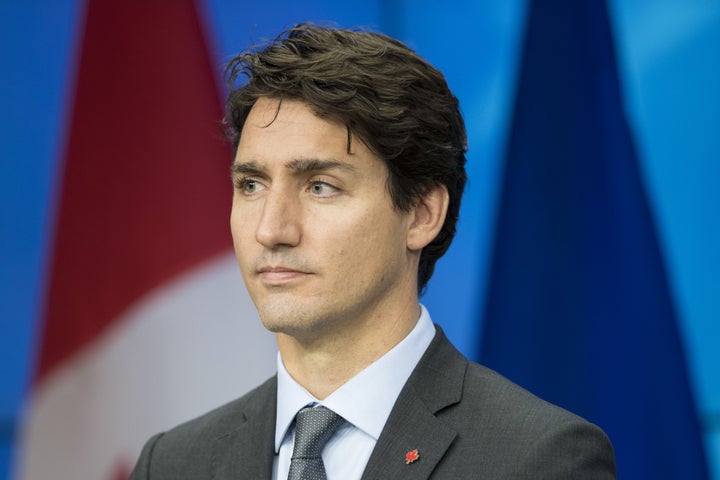 Canadian Prime Minister Justin Trudeau looks on during a news conference after signing the Comprehensive Economic and Trade A