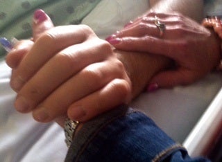 <p>A poignant photo of the last time Laurie held her son’s hand in the hospital</p>