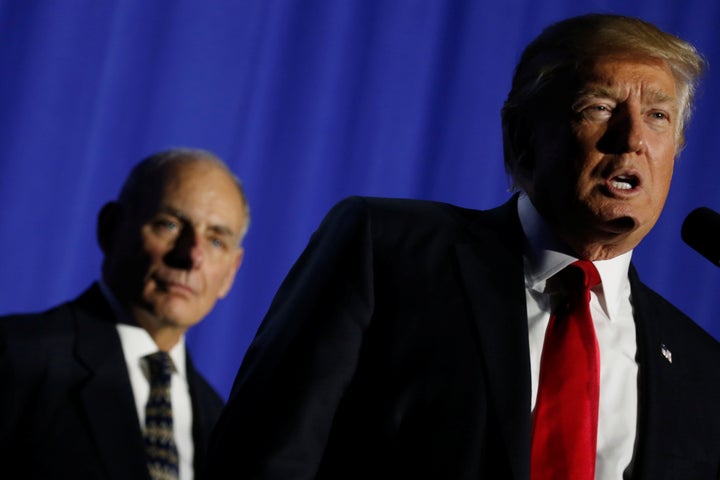 U.S. President Donald Trump (R), flanked by Homeland Security Secretary John Kelly (L), delivers remarks at Homeland Security headquarters in Washington, U.S., January 25, 2017.