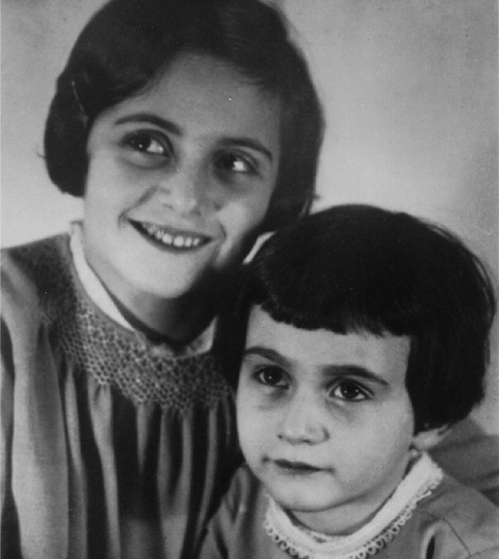 An undated family photo of Anne Frank as a young child with her older sister.