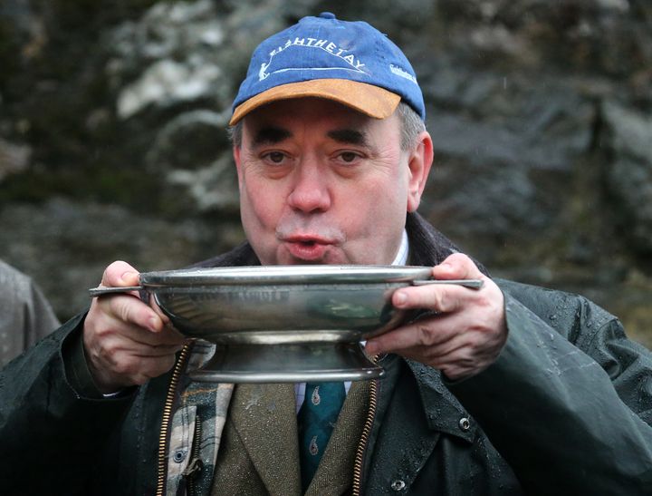 Former Scottish First Minister Alex Salmond sipping whisky from a Quaich