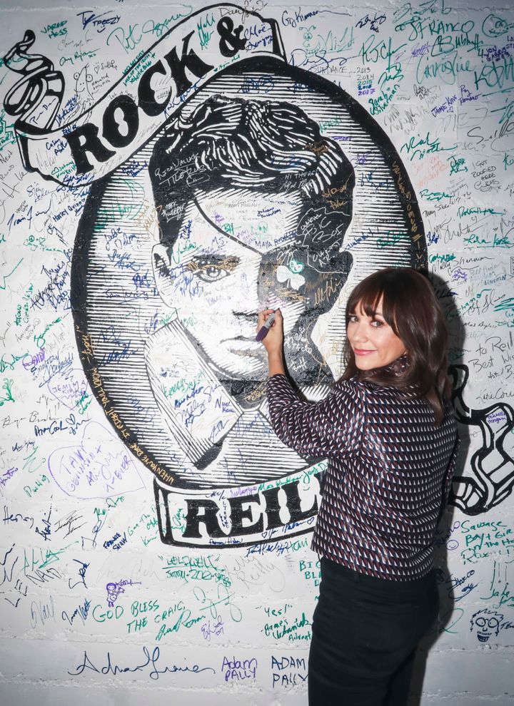 <p>Rashida Jones signing the wall at Rock & Reilly’s during the 2017 Sundance Film Festival.</p>