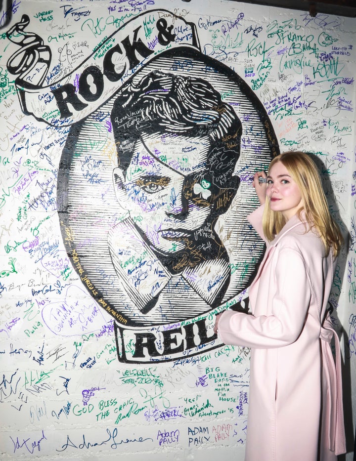 Elle Fanning signing the wall at Rock & Reilly’s during the 2017 Sundance Film Festival.