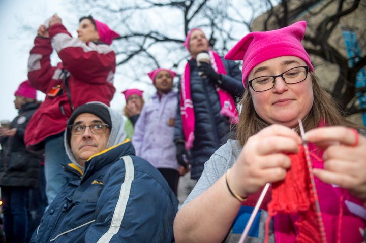 Emily Crowley from Vermont knits a pink hat for protesters at the Women's March on Washington.