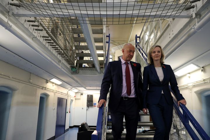 Justice Secretary Liz Truss, pictured above at HMP Brixton with Prison Governor David Bamford, has cautioned that the issues would not be dealt with 'in weeks or months'