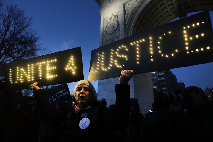 Hundreds of people attend a Wednesday evening rally at Washington Square Park in New York City in support of Muslims and immigrants and against the building of a wall along the Mexican border.