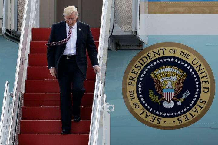 President Donald Trump walks off Air Force One, Thursday, Jan. 26, 2017, after arriving at the Philadelphia International Airport in Philadelphia, before speaking at the Republican Congressional retreat.