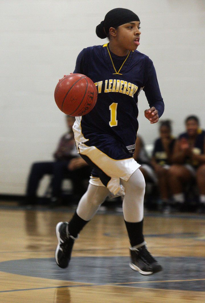 Bilqis Abdul-Qaadir wears a hijab and long sleeves and covers her legs under her uniform when she plays basketball.