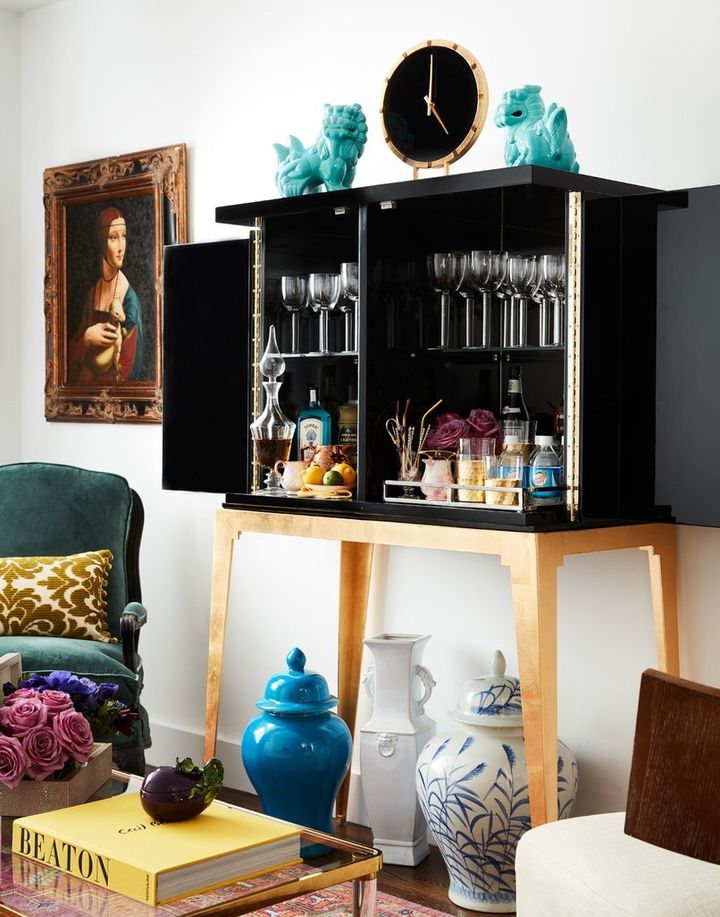A large bar cabinet makes a statement in a small space while providing ample (and attractive) storage.