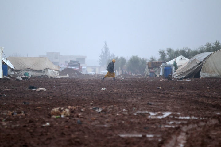 An internally displaced Syrian woman walks in the Bab Al-Salam refugee camp, near the Syrian-Turkish border, northern Aleppo province, Syria December 26, 2016.