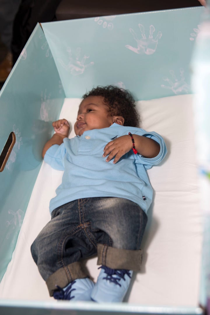 The universal baby box program aims to prevent infant deaths due to unsafe sleeping environments.
