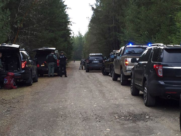 Police vehicles line the road near a rural property near Belfair, Washington, Feb. 26, 2016, in this handout photo provided by Mason County Sheriff's Office in Shelton, Washington.