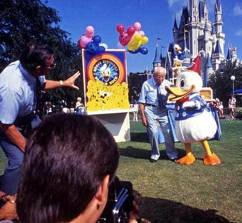<p>Charlie Ridgway (L) supervised a photo shoot with Clarence “Ducky” Nash (the original voice of Donald Duck) back in 1984 during Walt Disney World’s celebration of Donald’s 50th birthday.</p>