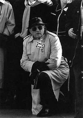<p>Charlie takes a knee in Paree back in April of 1992 as the opening day parade at Euro Disneyland rolls by.</p>