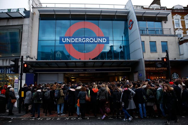 London Underground workers are to stage two walkouts from next Saturday; crowds of people are pictured above outside Brixton tube station earlier this month