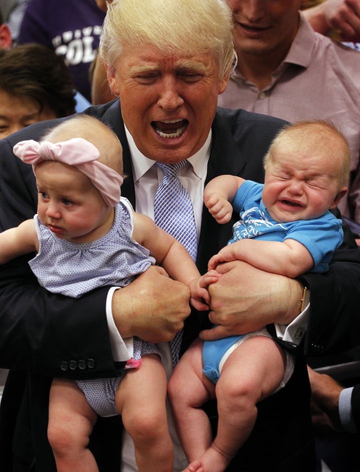 Trump imitates a crying babe, while holding another one, in Denver 