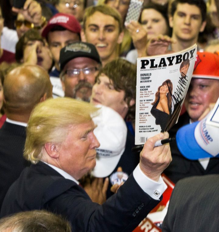 Trump autographs a copy of Playboy Magazine for a supporter at a rally at the Pensacola Bay Center in September 2016