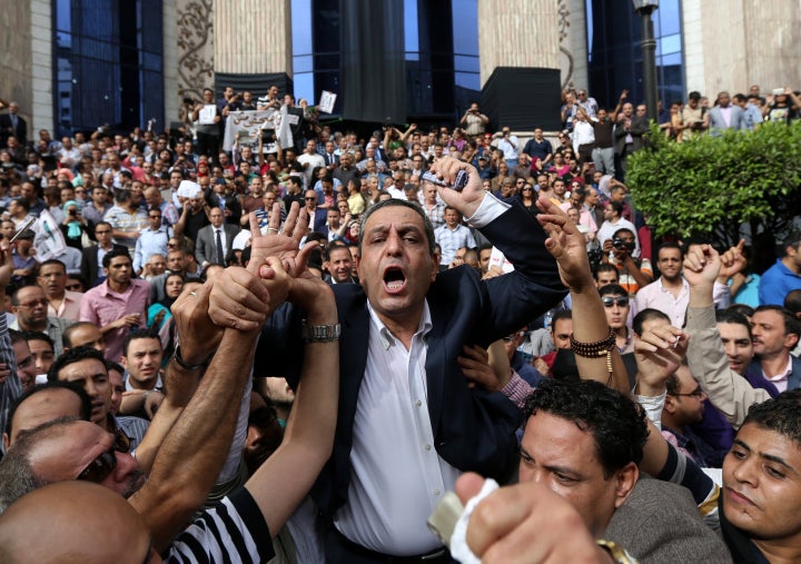 Journalists protest against restrictions on the press and to demand the release of detained journalists in front of the Egyptian Press Syndicate's headquarters in downtown Cairo, Egypt, on May 4, 2016.