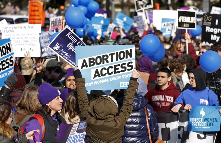 Protesters demonstrate in front of the U.S. Supreme Court in Washington March 2, 2016.