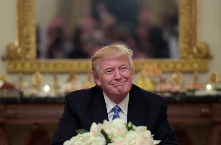 President Donald Trump hosts a reception for House and Senate leaders in the the State Dining Room of the White House.