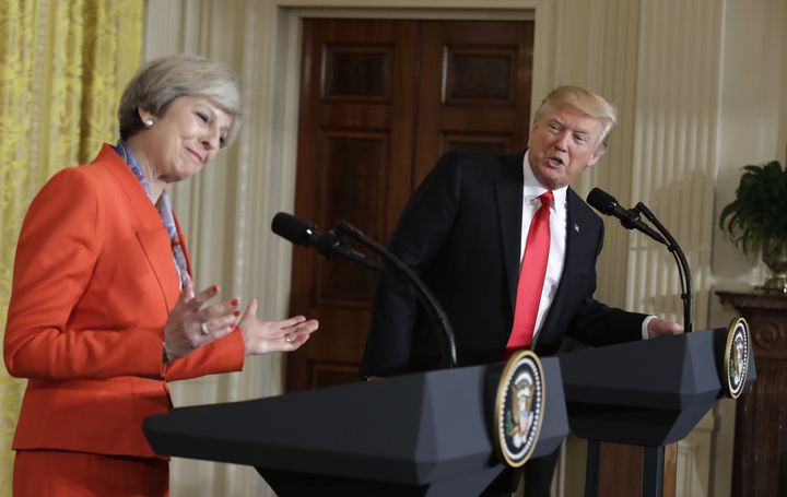 Theresa May gestures as President Donald Trump speaks during their news conference in the East Room of the White House