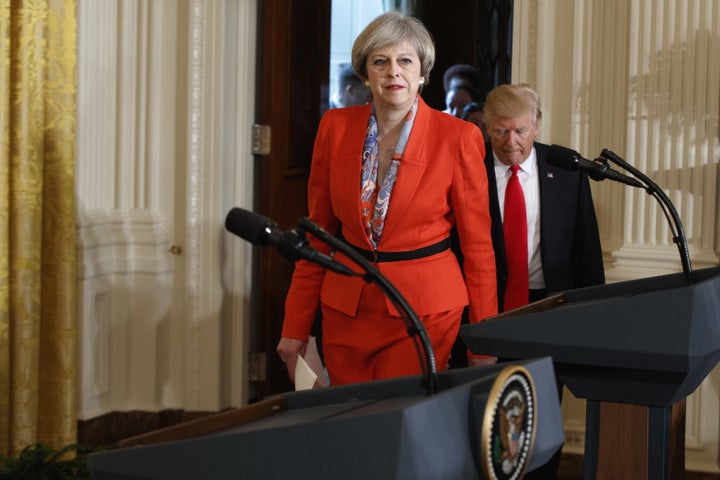 May and Trump arrive for their joint news conference in the East Room of the White House