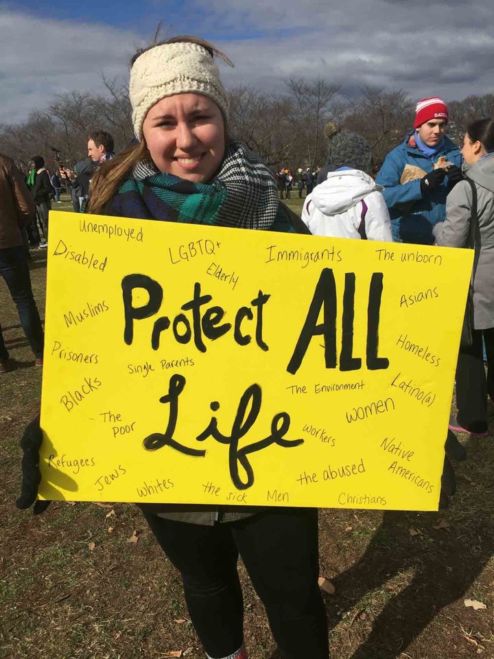 Miranda Malone, 21, holds a poster during Friday's anti-abortion rally in Washington.