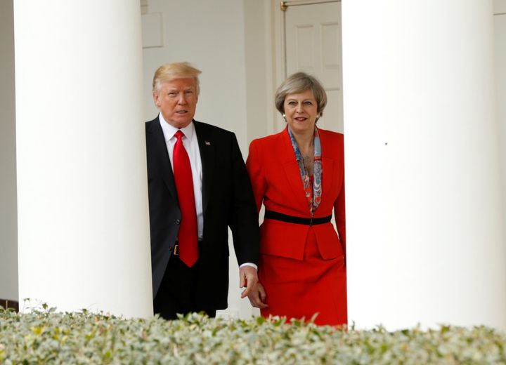 President Donald Trump 'escorts' Theresa May after their meeting at the White House.