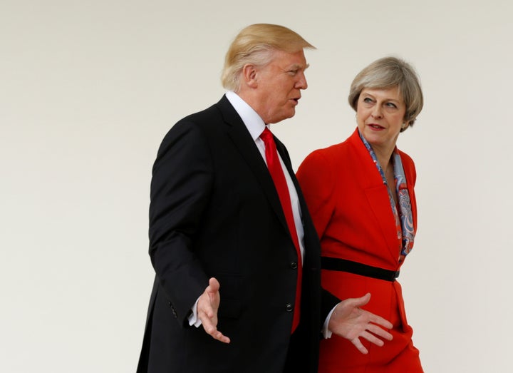 U.S. President Donald Trump escorts British Prime Minister Theresa May after their meeting at the White House on Jan. 27