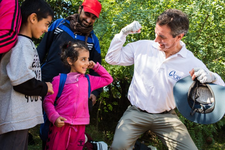 Sean Callahan, president and CEO for Catholic Relief Services, spends time with refugee children along the Serbia and Croatia