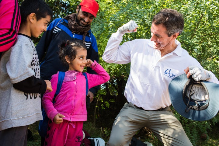 Sean Callahan, president and CEO for Catholic Relief Services, spends time with refugee children along the Serbia and Croatia border during a trip overseas. 