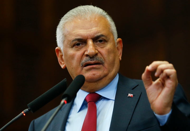 Turkish Prime Minister Binali Yildirim addresses members of Parliament in Ankara on July 19, 2016.