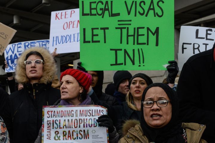 Protesters rally at New York's John F. Kennedy International Airport in opposition to Trump's severe restrictions on immigration and travel.