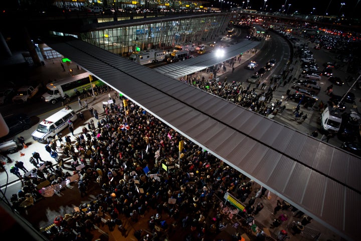 Protesters swarm John F. Kennedy Airport to protest Donald Trump's executive order blocking travelers from seven predominantly Muslim nations.