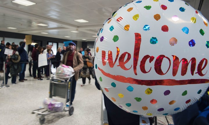 Protesters at Dulles International Airport in Sterling, Virginia, gather to protest Trump and welcome immigrants.