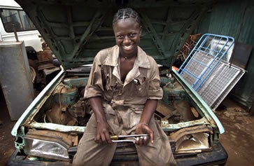 A young woman professionally trained as an auto mechanic in Kenya: Creating jobs for women poses particular challenges. 