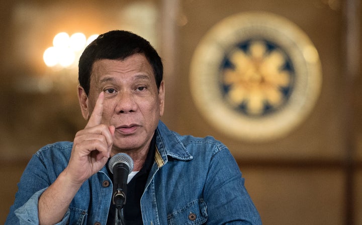 Philippine's President Rodrigo Duterte gestures as he answers a question during a press conference at the Malacanang palace i