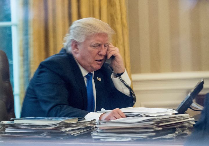Donald Trump speaks on the phone with German Chancellor Angela Merkel on Saturday.
