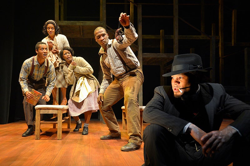 Black Rat (William Hartfield) eavesdrops on a scene with Bigger's family in a scene from <strong><em>Native Son</em></strong>