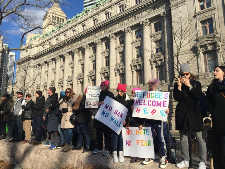 Protesters carried signs reading