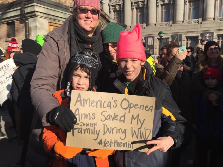 Rabbi Alysa Mendelson Graf and her sons at the protest in Battery Park in New York City. 