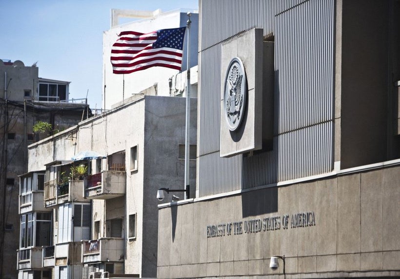 A flag flutters outside the U.S. embassy in Tel Aviv, Israel, August 4, 2013.