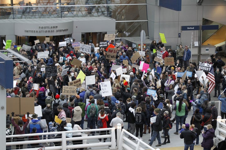 <strong>Activists gather at Portland International Airport to protest against President Donald Trump's executive action travel ban.</strong>