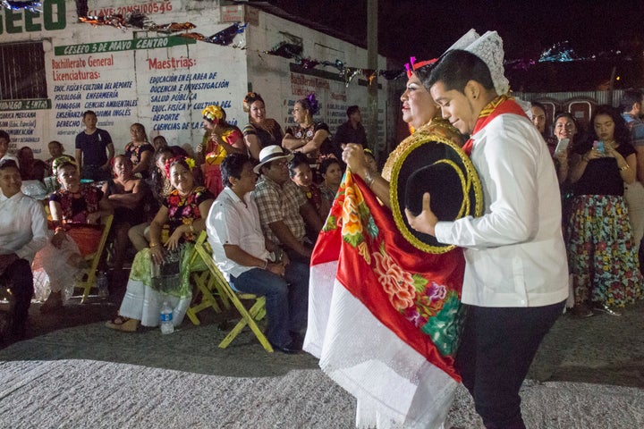 Jesusa Hernandez Noriega, left, the “Queen of Queens,” paraded to the festival stage alongside her dance partner.