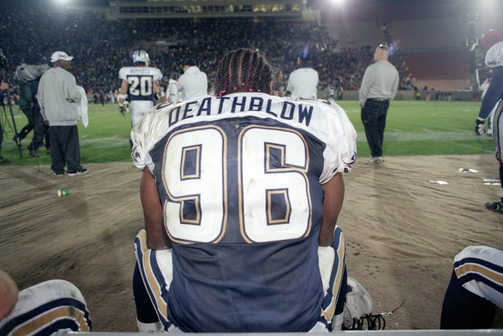 Jamal "Deathblow" Duff of the Los Angeles Xtreme takes a break during a game against the Chicago Enforcers on Feb. 10, 2001. XFL players displayed their nicknames, rather than their last names, on the back of their jerseys. 