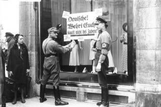 Stores owned by Jews were marked in Germany, leading to the Night of Broken Glass in which hundreds of synagogues and over 7500 businesses were burned. 