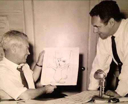 Bill Hanna (L) and Joe Barbera with a drawing of Huckleberry Hound, one of the first characters they created for television animation.